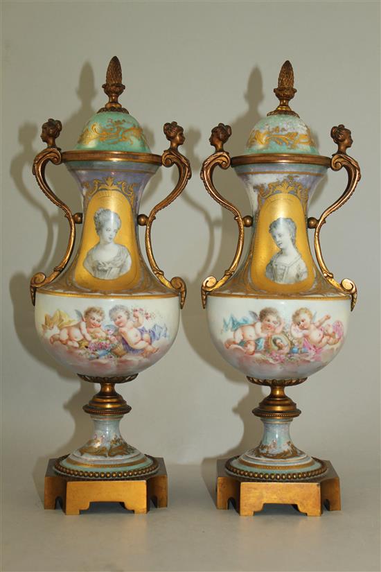 A pair of Sevres style porcelain and ormolu mounted vases and covers, late 19th / early 20th century, 31cm, one cover chipped